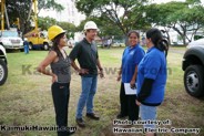 Darcy Endo-Omoto, Hawaiian Electric vice president - government & community affairs, and Scott Seu, with Kaimuki playground staff.